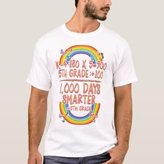 a man wearing a white t - shirt with rainbows and words on it