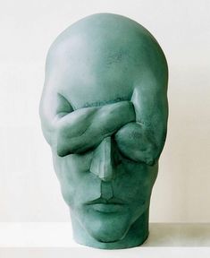 an advertisement with a green head and hands covering it's eyes in front of a white background