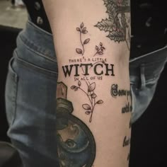 a person with a tattoo on their leg that reads, there's a little witch in all of us