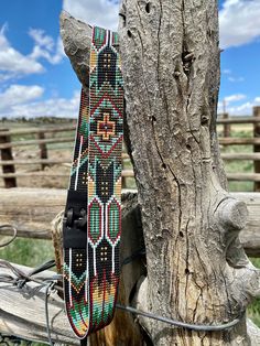 1.25" Wide Beaded Hatband. Black leather ends and black deerskin ties.  This hatband is 22.25" long (including leather ends) and has adjustable ties in the back.  It will fit most cowboy hats. If you wear smaller than a 6 7/8 or larger than 7 3/4" you may need to order a custom sized hatband. Please measure your hat to make sure this will fit, since I cannot accept returns due to the nature of the product.  If you would like more than one of these hatbands, or would like it done in different colors, please send me a message and I can make a custom for you. Custom times are generally 4-8 weeks out. Beaded Hats, Beaded Hat Bands, Beading Designs, Native Beading, Hat Bands, Native American Beaded Earrings, Beaded Hat, Beaded Rope, Beaded Cross