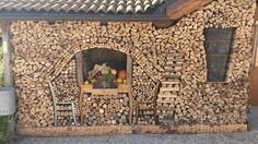 a house made out of logs and wood