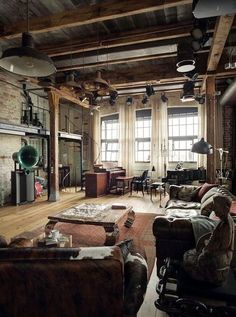 a living room filled with furniture and lots of windows