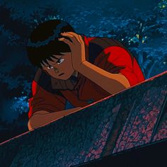 an animated image of a boy leaning on a ledge with his head in his hands