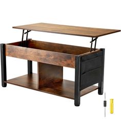 a wooden table with an open drawer underneath it and tools in front of it on a white background