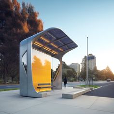 a person walking past a yellow and silver structure on the sidewalk in front of trees