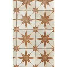 a white and brown tile with stars on it