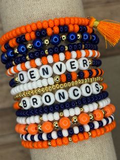 **IMPORTANT! DUE TO AN OUTAGE OF ORANGE BEADS, WE ARE HAVE DISABLED OUR OPTIONS WITH ORANGE BEADS. We have another option for orange beads, but they are not the same look as shown in these pictures. We can fill an order with those orange beads upon request! When orange beads come back available, we will update this post! The ultimate bracelet listing for any Denver Broncos Football fan! Go Broncos! These bracelets are SOLD INDIVIDUALLY unless purchased as a STACK! If wanting multiple bracelets, Broncos Bracelet, Football Bracelet, Go Broncos, Denver Broncos Football, Multiple Bracelets, Broncos Football, Spring Hill, Letter Beads, Denver Broncos