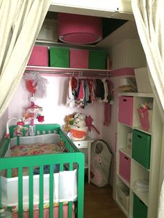 the baby's room is decorated in pink, green and white with lots of closet space