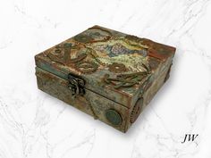 a decorative box sitting on top of a marble counter