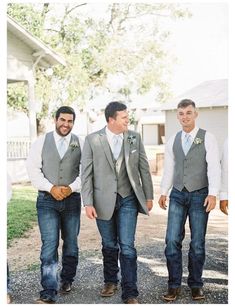 three men in vests and ties are walking together