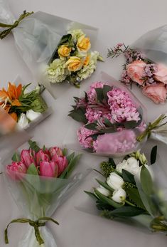 several different types of flowers are wrapped in plastic