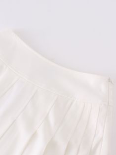 Experience effortless style with our Yolk Pleated Skirt in a classic white hue. The 37" length provides elegant coverage, while the pleated design adds texture to your look. Party Pleated Skirt Bottoms In Cream, Solid Color Pleated Hem Summer Skirt, Solid Color Summer Skirt With Pleated Hem, Party Cream Pleated Skirt, Elegant Mini Pleated Skirt With Lining, Elegant Mini Length Pleated Skirt With Lining, Elegant Mini Pleated Lined Skirt, Elegant Mini Length Pleated Lined Skirt, Elegant Cream Mini Skirt For Summer