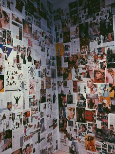 a wall covered in pictures and photos next to a toilet