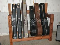 guitar cases are lined up on a shelf