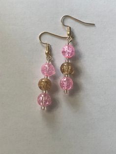 These pink and gold, handmade earrings are great for Valentines Day, Mother's Day, or any occasion really! They are made out of glass beads and you can choose whether you want the ear piece to be gold or silver! These earrings are lightweight, comfortable to wear, and handmade with love! Plus, they have free shipping! What could be better? Thank you for checking out my shop and have a great day! Pink And Gold Earrings, Pink Beaded Earrings, Ear Piece, Gold Bead Earrings, Glass Bead Earrings, Wire Jewelry Designs, Earring Ideas