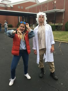 two people dressed up in costumes posing for the camera