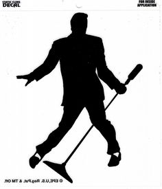 the silhouette of a man holding two hockey sticks and wearing a suit with his arms outstretched