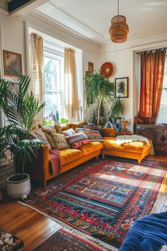 a living room filled with lots of furniture and plants