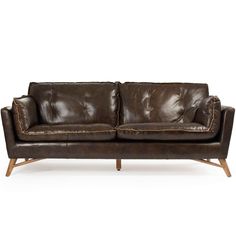 a brown leather couch sitting on top of a white floor