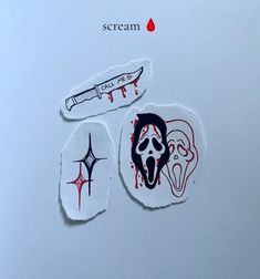 two stickers depicting the faces of zombies and a knife with blood dripping down them