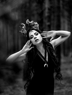 black and white photograph of a woman with long hair wearing a wreath on her head