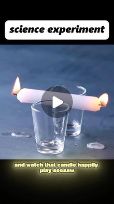 a candle is sitting in a glass with water on the table next to it and an ad for science experiment