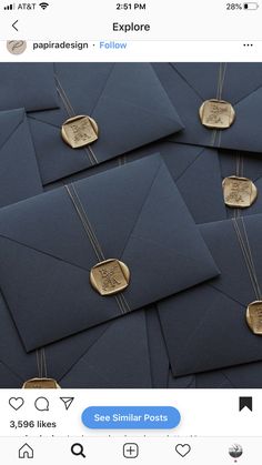 many blue envelopes with gold stamps on them