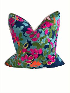 a blue and pink flowered hat on a white background