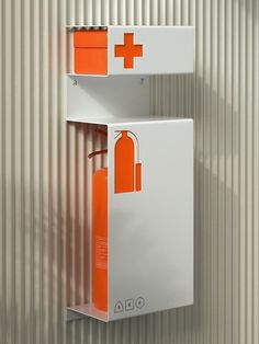 an orange fire extinguisher hanging on a wall