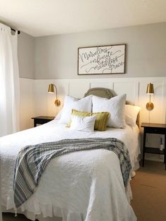 a bed with white linens and yellow pillows