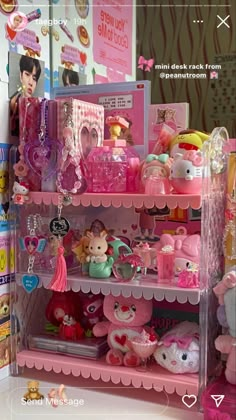 a pink shelf filled with lots of toys