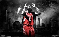 the basketball player is holding his hands up in the air with city lights behind him