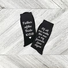 two pairs of black socks that say, father of the bride and i do not know what