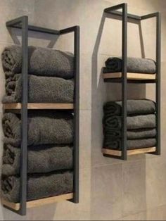 two shelves with towels on them in a bathroom