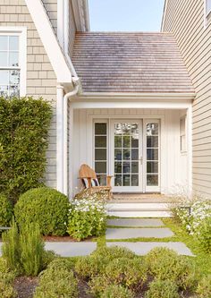 the front door of a house with white trim