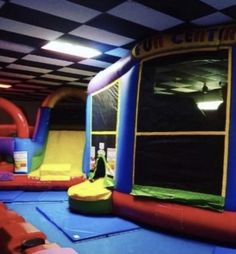 an inflatable bounce house with slides and slides