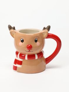 a ceramic mug shaped like a deer with horns and scarf around its neck, on a white background