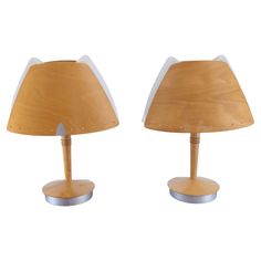 two wooden lamps with metal bases on white background