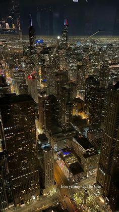 an aerial view of the city lights at night from high up in the skyscrapers