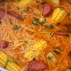 corn on the cob and sausage soup with parmesan cheese