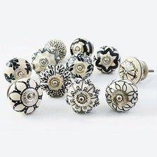 a bunch of different types of knobs on a white surface