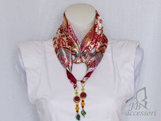 Are you a woman who wants to feel chic and showcase unique accessories? ⠀ Here's an idea created by me - the jewel scarf. It not only adds a touch of color to your sweater or shirt but also keeps your neck warm. ⠀ ⠀ This original and practical necklace can be worn in various ways and adapted to any type of outfit. ⠀ ⠀ The jewel scarf is enriched with a composition of beads of different sizes, including ceramic beads and molded and decorated shell beads, all entirely handmade.  Ideal as a gift idea for mothers, wives, or girlfriends; great for Christmas, birthdays, Valentine's Day, and many other occasions. ⠀  Love my work, but can't find the right color? ⠀ Write to me, I can create customizations to make your perfect accessory ❣ Necklace With Ring, Italy Gift, Fabric Scarf, Gift Idea For Women, Scarf Necklace, Unique Accessories, Beads Handmade, The Jewel, Scarf Jewelry