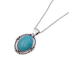 "A very unique bluish green turquoise jade pendant in an oval setting. This lovely light teal pendant features dyed white natural jade and set in dainty silver plated pewter pendant. A lightweight and sturdy stainless steel cable chain with lobster clasp ensures a secure fit. Depending on the light, the stone may appear more blue or green like dark aqua or turquoise. The last photo shows the intricate details on the back of the pendant. Measurements(approx, see 3rd photo) Chain Length:18\" Stone:18x13 mm Pendant:1\" +bail .4\" Pendant Width:.75\"" Turquoise Oval Cabochon Necklace Gift, Teal Stone, Photo Chain, Teal Necklace, Dark Aqua, Oval Setting, Pewter Pendant, Stainless Steel Cable, Handmade Fashion Jewelry