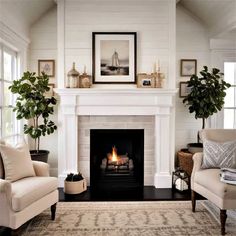 a living room filled with furniture and a fire place in the middle of a fireplace