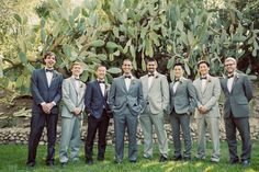 a group of men in suits standing next to each other