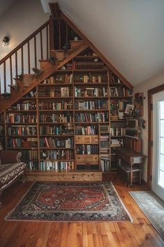 a book shelf in the corner of a room with stairs and bookshelves on it