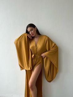 Kimono sleeves long robe - tie waist - open front - kimono sleeves - two side slits Sizes: Regular size - hips to 107 cm (42 inch) Plus size - hips more than 107 cm (42 inch) Fabric - 30% viscose, 70% polyester Your order is packed in an eco-pack of 100% cotton. This bag is convenient for storing and washing our product Shipping terms: Delivery to Europe - 1-2 weeks Delivery to USA, UK 1-3 weeks Australia, Canada - 2-4 weeks Returns & exchanges 1. Confirmation Period: We confirm exchanges and re Deep Plunge Robe, Golden Kimono, Golden Jumpsuit, Crop Top Lehenga, Desert Chic, Crop Top Jacket, Womens Wrap Dress, Modern Desert, Tech Wear