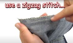 someone is stitching the side of a pair of jeans with their thumbnails