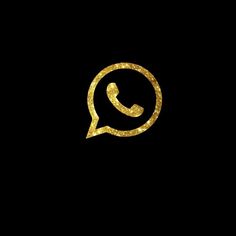 a phone with gold glitter in the shape of a speech bubble on a black background