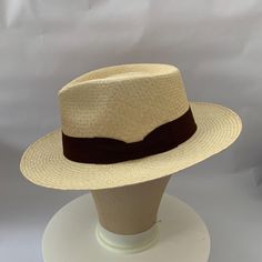 Panama Hat from Seconds(Damaged) due to very minor discolouration on the front crown of hat. As seen in pictures the slight discolouration is very hard to notice and therefore this hat is in almost perfect condition.  This Hat feautures a Herringbone weave meaning it is long lasting and durable, making it ideal for travel, adventures or a long-term purchase. However we recommend you do not role this model of hat due to the pattern of weave. This hat comes in its' natural Toquilla Straw colour an Classic Solid Brimmed Panama Hat, Classic Brimmed Panama Hat In Solid Color, Classic Solid Panama Hat With Brim, Classic Solid Panama Hat, Classic Cream Hats With Short Brim, Classic Beige Hat With Curved Brim, Formal Natural Hat With Short Brim, Classic Beige Panama Hat With Curved Brim, Classic Cream Brimmed Hats